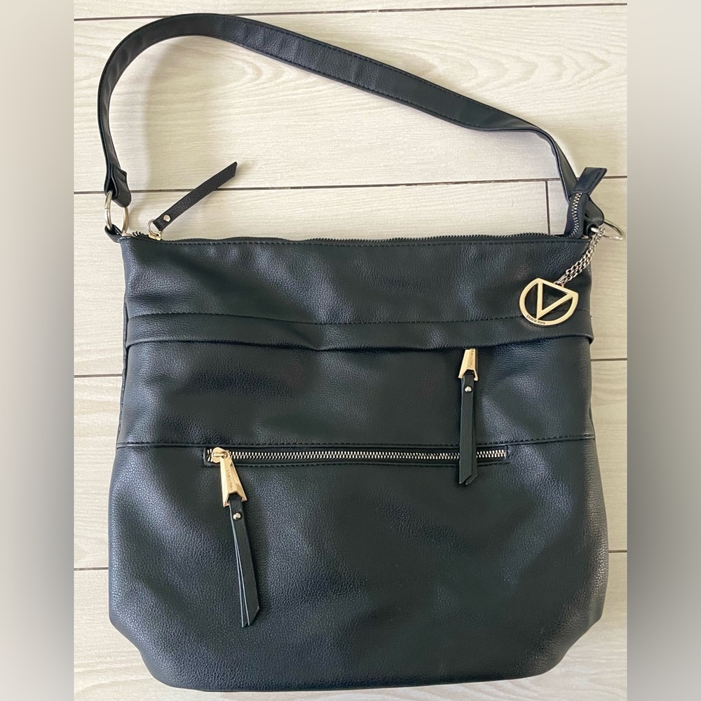 Dolce Vita black tote/purse‎ with gold zippers. Two front zip pockets and V logo